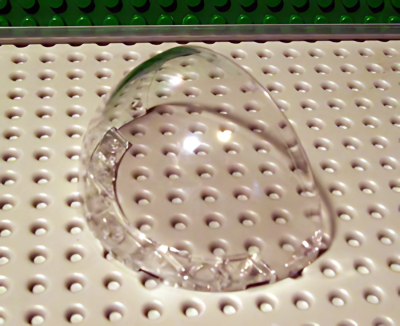 Деталь LEGO Windscreen 8 x 4 2/3 x 3 2/3 Quarter Sphere (Outer) with Hinge Holes 88067 Trans-Clear U